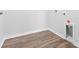 Functional laundry room with wood flooring and a utility sink at 1127 Nw Rosefield Way, Calabash, NC 28467