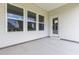 Covered patio with three windows and exterior door at 1127 Nw Rosefield Way, Calabash, NC 28467