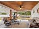 Relaxing screened porch with seating area, hot tub, and ceiling fan at 119 Clemson Rd., Conway, SC 29526