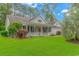 Charming one-story home with a red door and well-manicured lawn at 1226 Foxtail Dr., Longs, SC 29568