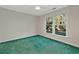 Spacious bedroom featuring green carpet and a large window at 1305 Conifer Ct., Murrells Inlet, SC 29576