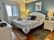 Spacious bedroom with a king-size bed and en-suite bathroom at 1317 S Ocean Highway # 304, Surfside Beach, SC 29575