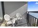 Balcony with chairs and a small table at 1501 S Ocean Blvd. # 1447, Myrtle Beach, SC 29577