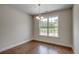 Bright dining room features hardwood floors and a large window at 154 Six Mile Creek Dr., Georgetown, SC 29440