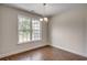 Bright dining room with hardwood floors and a view from a large window at 154 Six Mile Creek Dr., Georgetown, SC 29440