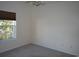 Carpeted bedroom with a window offering a view of nature at 1990 Cross Gate Blvd. # 202, Surfside Beach, SC 29575