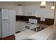 Kitchen with white cabinets, a breakfast bar, and stainless steel sink at 1990 Cross Gate Blvd. # 202, Surfside Beach, SC 29575