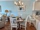 Coastal-themed dining area with a round table and four chairs at 1990 N Waccamaw Dr. # 1209, Garden City Beach, SC 29576