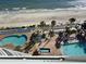Aerial view of resort pools, loungers, and ocean at 201 S Ocean Blvd. # 714, Myrtle Beach, SC 29577