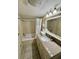 Bathroom with a jetted bathtub and granite vanity at 201 S Ocean Blvd. # 714, Myrtle Beach, SC 29577