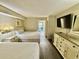 Bedroom with two double beds, dresser, and ocean view at 201 S Ocean Blvd. # 714, Myrtle Beach, SC 29577