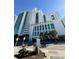 Oceanfront high-rise building with palm trees and ample parking at 201 S Ocean Blvd. # 714, Myrtle Beach, SC 29577
