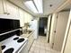 Well-equipped condo kitchen with white cabinets at 201 S Ocean Blvd. # 714, Myrtle Beach, SC 29577
