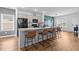 Modern kitchen island with seating, granite countertops, and gray cabinets at 228 Averyville Dr., Conway, SC 29526