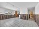 Unfinished basement with tiled floor and large window at 310 34Th Ave. N, North Myrtle Beach, SC 29582