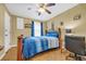 Cozy bedroom with a double bed, ceiling fan, and wood floors at 310 34Th Ave. N, North Myrtle Beach, SC 29582