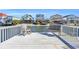 Relaxing waterfront dock with rocking chairs at 310 34Th Ave. N, North Myrtle Beach, SC 29582