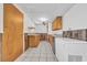 Small galley kitchen with wood cabinets and appliances at 310 34Th Ave. N, North Myrtle Beach, SC 29582