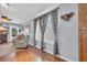 Living room with hardwood floors, a fireplace, and access to the backyard at 310 34Th Ave. N, North Myrtle Beach, SC 29582