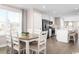 Open concept dining room with hardwood floors and kitchen views at 329 Bent Green Ct. # 90E, Murrells Inlet, SC 29576