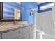 Bathroom with blue walls, marble vanity, and shower/tub combo at 338 Harbour View Dr., Myrtle Beach, SC 29579