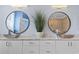 Elegant bathroom with and sinks and large circular mirrors at 338 Harbour View Dr., Myrtle Beach, SC 29579