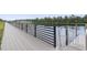 Community boardwalk with water access and metal railing at 338 Harbour View Dr., Myrtle Beach, SC 29579