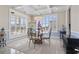 Elegant dining room featuring a glass-top table and chandelier at 338 Harbour View Dr., Myrtle Beach, SC 29579