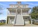 Three-story home with two-car garage and elevated front porch at 338 Harbour View Dr., Myrtle Beach, SC 29579