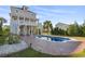 Two-story home with pool, large deck, and landscaped yard at 338 Harbour View Dr., Myrtle Beach, SC 29579