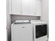 Convenient laundry room with Maytag washer and dryer, and cabinets at 338 Harbour View Dr., Myrtle Beach, SC 29579
