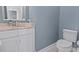 Modern powder room with white cabinets and marble countertop at 338 Harbour View Dr., Myrtle Beach, SC 29579