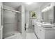 Elegant bathroom with double vanities, a large walk-in shower, and a modern design at 437 N Boyle Dr., Pawleys Island, SC 29585