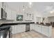 Bright eat-in kitchen with white cabinets, granite counters, and stainless steel appliances at 437 N Boyle Dr., Pawleys Island, SC 29585