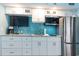 White shaker cabinets, granite countertops, and stainless steel appliances at 4800 Ocean Blvd. S # 915, North Myrtle Beach, SC 29582