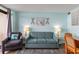 Living area with sofa, chairs, and coastal decor at 4800 Ocean Blvd. S # 915, North Myrtle Beach, SC 29582