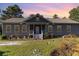 Beautiful ranch home with stone accents and a welcoming front porch at 5373 Highway 66, Loris, SC 29569