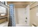 Bathroom with shower/tub, blue floral shower curtain, and storage shelving at 6001 - P-29 S Kings Hwy., Myrtle Beach, SC 29575