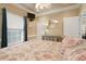Bedroom with king-size bed, window seating, and built-in shelving at 6001 - P-29 S Kings Hwy., Myrtle Beach, SC 29575