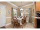 Small dining area with a table for four and festive tablecloth at 6001 - P-29 S Kings Hwy., Myrtle Beach, SC 29575