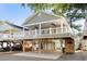 Two-story elevated home with garage and covered porch at 6001 - P-29 S Kings Hwy., Myrtle Beach, SC 29575