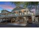 Elevated beach house with covered porch and parking underneath at 6001 - P-29 S Kings Hwy., Myrtle Beach, SC 29575