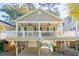 Elevated home with large deck, carport, and charming curb appeal at 6001 - P-29 S Kings Hwy., Myrtle Beach, SC 29575
