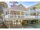 Elevated home with large deck, carport, and charming curb appeal at 6001 - P-29 S Kings Hwy., Myrtle Beach, SC 29575
