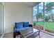 Relaxing screened porch with seating and view of the backyard at 601 Hillside Dr. N # 3805, North Myrtle Beach, SC 29582