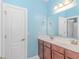 Bathroom with a double vanity and light blue walls at 695 Iredel Ct., Calabash, NC 28467