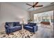 Living room with two sofas, a sunroom, and hardwood floors at 9 Bear Creek Loop, Murrells Inlet, SC 29576