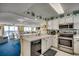 Well-equipped kitchen, white cabinets, stainless steel appliances at 1003 S Ocean Blvd. # 505, North Myrtle Beach, SC 29582