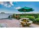 Community patio with picnic table, umbrella, and grill at 1003 S Ocean Blvd. # 505, North Myrtle Beach, SC 29582