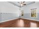 Spacious bedroom with hardwood floors and ceiling fan at 1040 Foxtail Dr., Longs, SC 29568